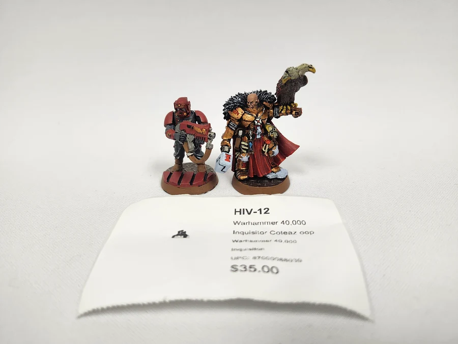 image Frontline Gaming Two Warhammer 40000 miniatures Inquisitor Coteaz and companion on display with a price tag reading