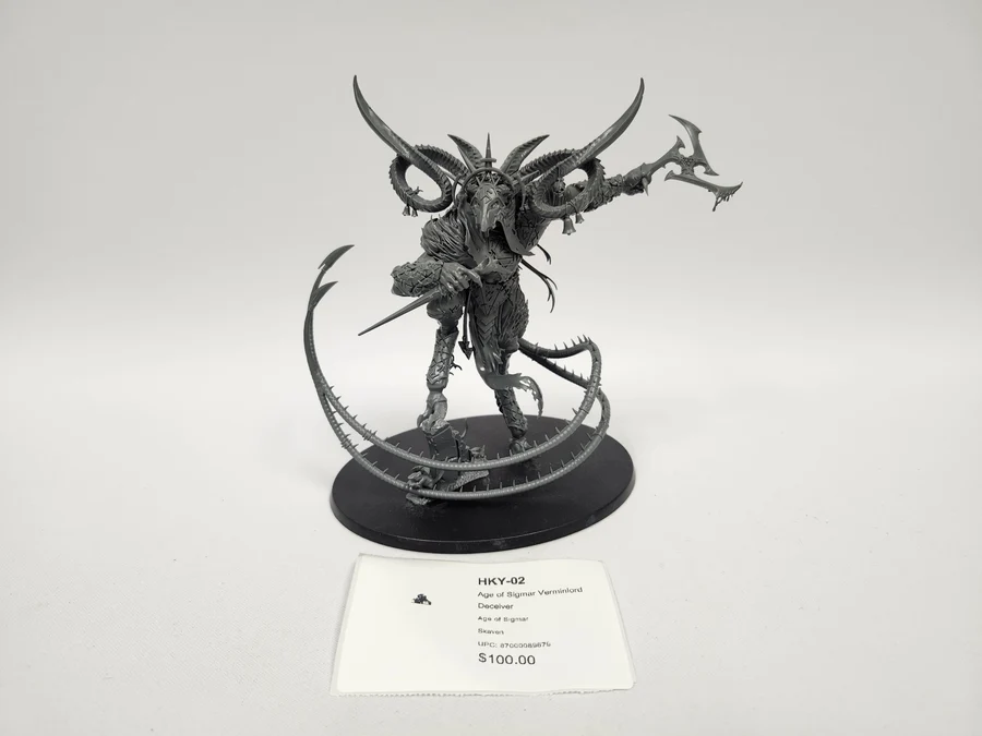 image Frontline Gaming Grey horned demon miniature wielding a blade standing on a black round display base with circular spiked rings around it