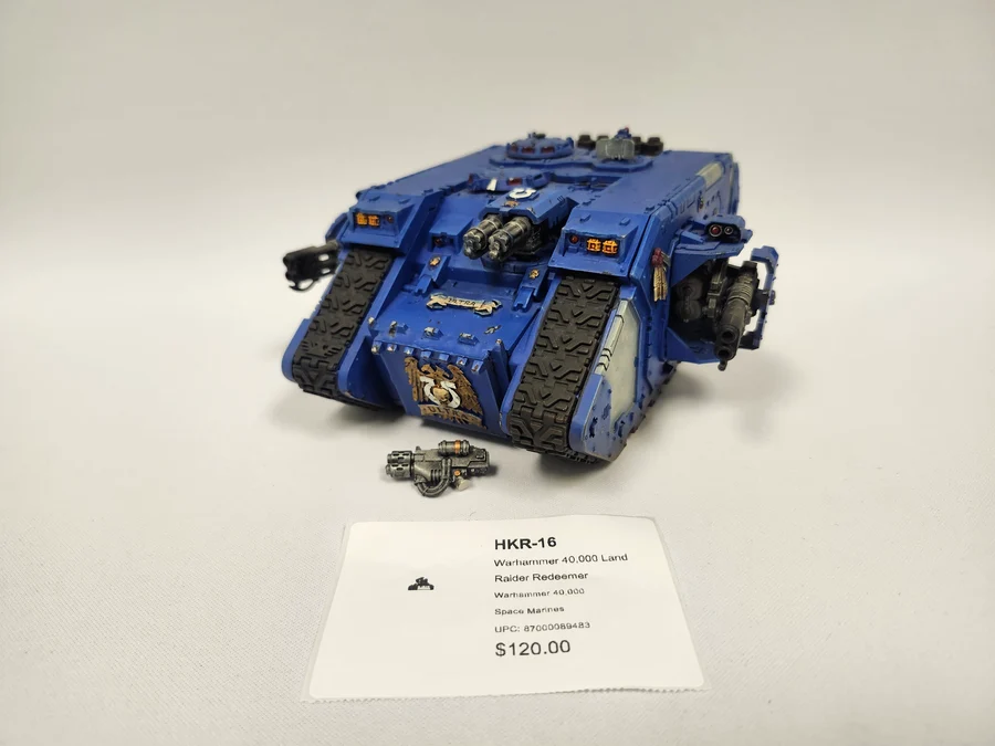 image Frontline Gaming Blue miniature tank model with tracks and mounted guns on a white display price tag shows 0