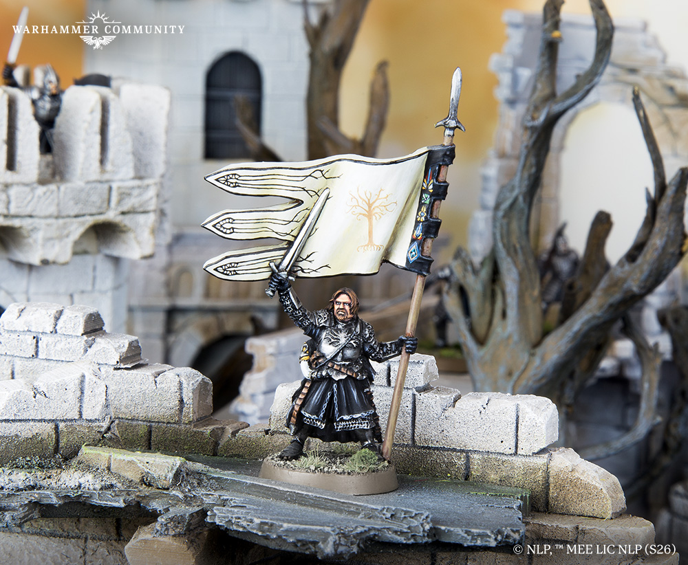 image Frontline Gaming Miniature knight in black armor raises a cream banner with a tree emblem amid ruined stone ruins on a Warhammer diorama.