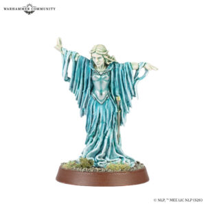 Warhammer miniature a spectral blue robed woman with arms outstretched standing on a brown circular base
