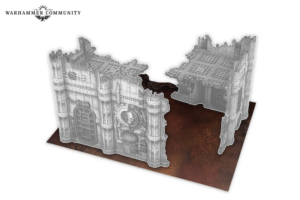 Grey ruined fortress walls model with a central break, set on a brown gaming base; Warhammer Community logo visible in the corner.