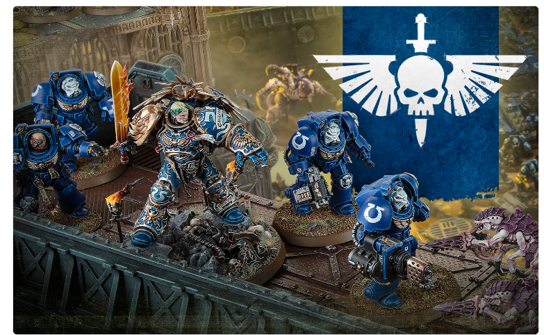 Blue armored Space Marines advance across a ruined battlefield with a large winged skull banner in the background