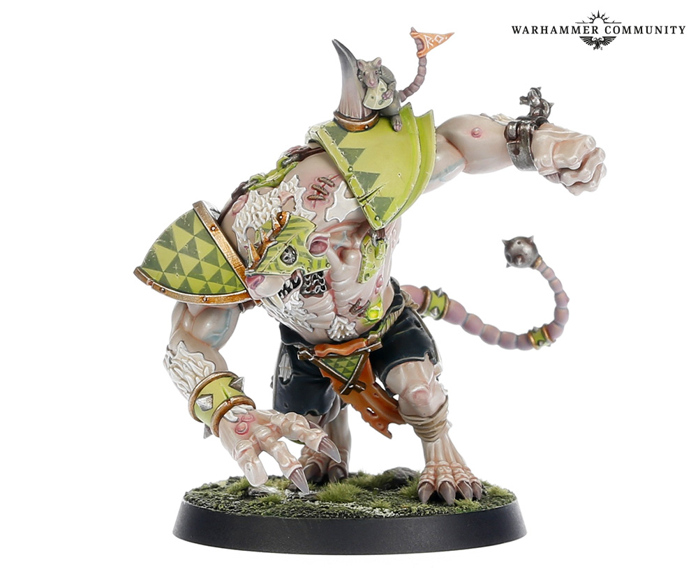 image Frontline Gaming Warhammer mini large ogre in lime green triangle patterned armor crouching on a grassy base with a tiny creature on its shoulder