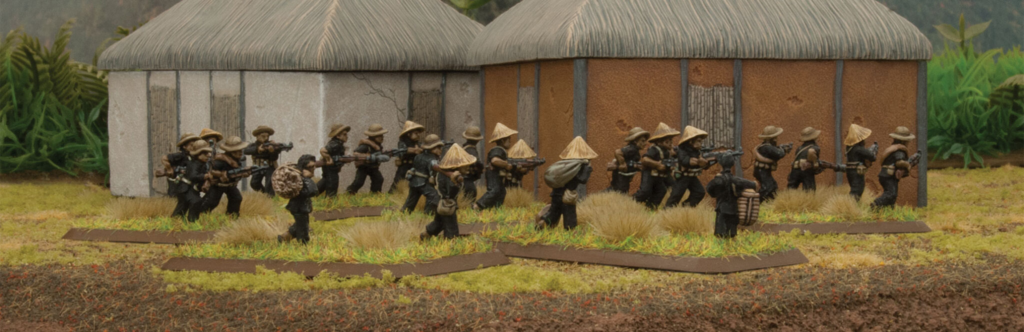 image Frontline Gaming Group of toy soldiers in black uniforms advancing with rifles in a diorama village