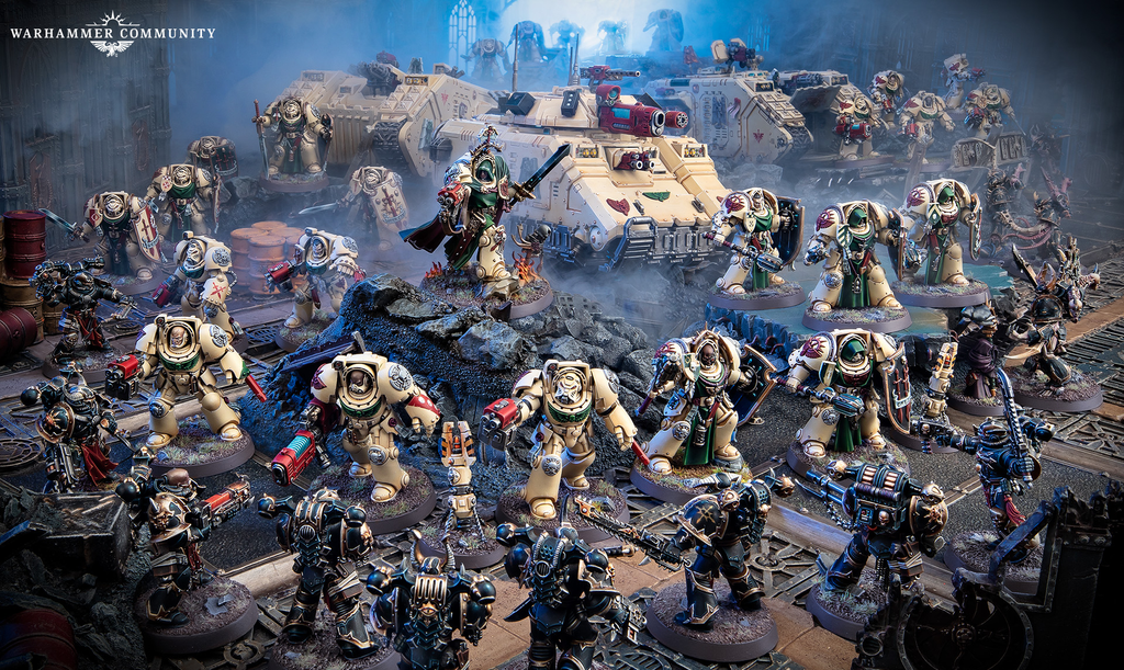 Warhammer 40K battle scene with beige Space Marines and tanks amid smoky ruins logo in corner