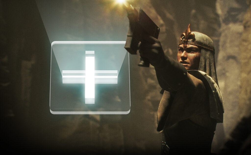 Armored warrior aiming a gun at a glowing white medical cross symbol on a translucent panel to the left