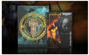Boxed Warhammer 40k collectibles set with ornate circular emblem on the largest cover flanked by two smaller boxed editions against a dark background