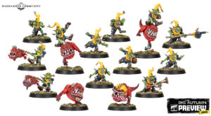 Collection of green goblin miniatures with yellow hoods posed on round bases wielding spears swords and a trumpet from a Warhammer preview image