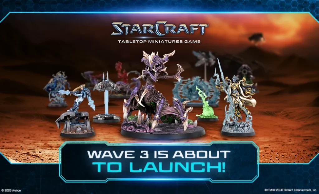 StarCraft tabletop miniatures on a desert battlefield with a neon banner WAVE 3 IS ABOUT TO LAUNCH