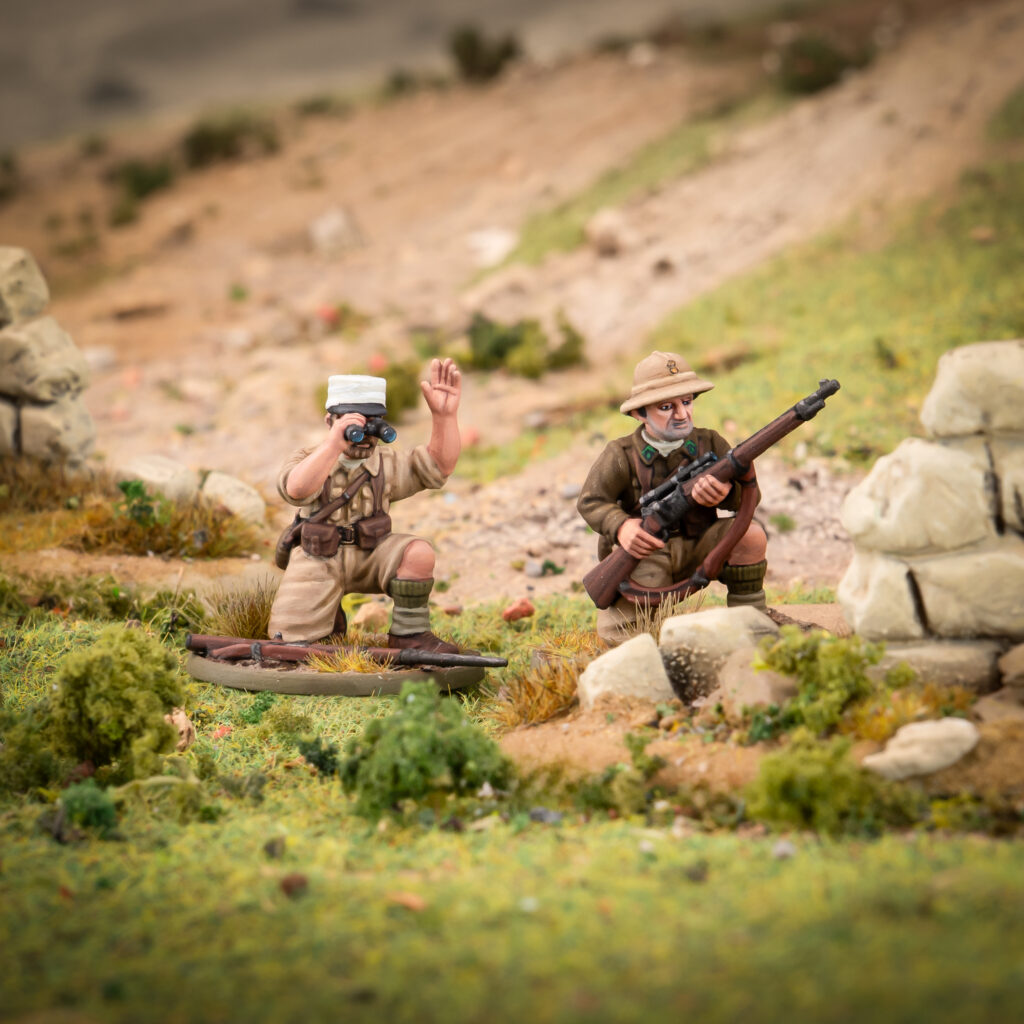 FrenchForeignLegionInfantrySniper1024x1024 Frontline Gaming Two toy soldiers in a diorama one kneels with binoculars raised the other crouches behind rocks with a rifle in a desert like landscape