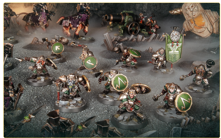 Tabletop battle scene with silver green armored miniatures round green shield emblems a banner and ruined battlefield scenery