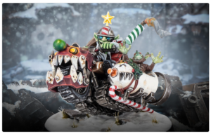 Snowy diorama of a fantastical armored vehicle ridden by goblins with candy cane missiles and a star on top of the scene