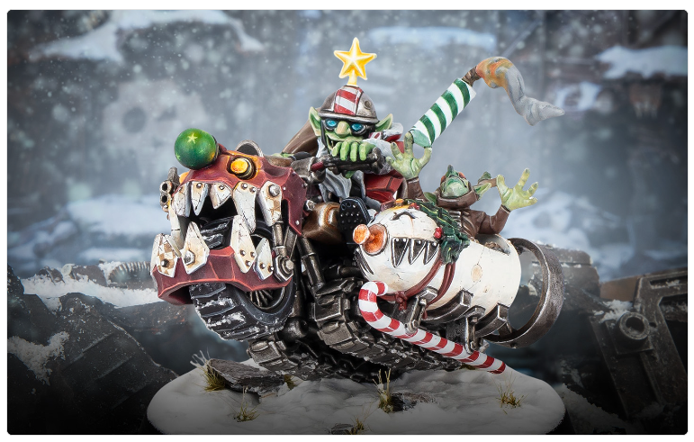 Screenshot 20261016 113651 Frontline Gaming Snowy diorama of a fantastical armored vehicle ridden by goblins with candy cane missiles and a star on top of the scene