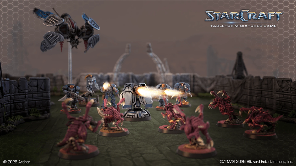 StarCraft tabletop battle scene with armored units firing at pink zergs on a ruined battlefield logo in the background