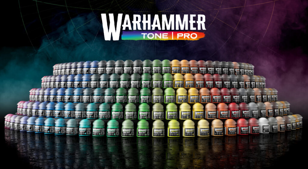 Pyramid of Warhammer Tone Pro paint bottles arranged in a rainbow with a colorful logo above